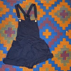Dark blue overall shorts. Forest Green overall shorts. Never worn! Medium.